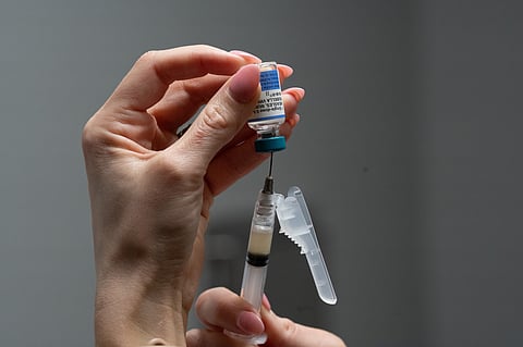 A nurse, prepares a combination measles, mumps and rubella vaccine for a patient at a pediatrics clinic in Easley, South Carolina, March 17, 2026.