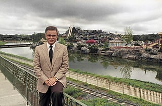 Television evangelist Jim Bakker poses in front of the Water Park in Columbia, SC, one of the attractions at his Heritage USA, March 19, 1987. 