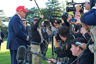President Donald Trump speaks with reporters after arriving on Marine One from the South Lawn of the White House, Tuesday, Oct. 6, 2026, in Washington.