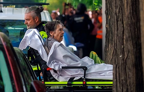 Maricarmen Abascal, an 87-year-old pensioner, is taken on a stretcher as she was evicted from her Madrid home, on September 23, 2026.