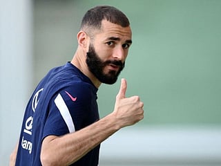 (FILES) In this file photo taken on October 8, 2021, France's forward Karim Benzema reacts after a training session at the Olympic stadium in Turin, two days prior to the UEFA Nations League final football match between Spain and France. - On December 19, 2022, Benzema announced in a Twitter post ending international career with France. (Photo by FRANCK FIFE / AFP)