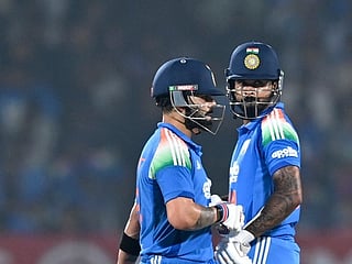India's Virat Kohli (L) and Shreyas Iyer gesture during the first one-day international (ODI) cricket match between India and New Zealand at the Kotambi Stadium in Vadodara on January 11, 2026.