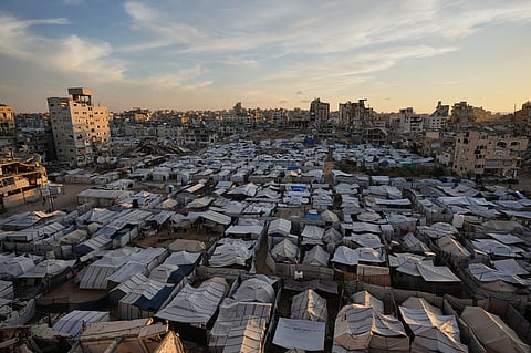 A makeshift tent camp for displaced Palestinians who lost their homes during the Israel-Hamas war stretches across Gaza City, Tuesday, Oct. 6, 2026. 