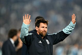Argentina's forward #10 Lionel Messi waves to fans in a tribute after the international friendly football match between Argentina and Benin at the Mas Monumental stadium in Buenos Aires on October 6, 2026.