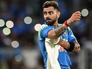 India's Virat Kohli wipes his sweat as he takes a break during the first one-day international (ODI) cricket match between India and West Indies at the Greenfield International Stadium in Thiruvananthapuram on September 27, 2026.