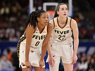 Kelsey Mitchell #0 and Caitlin Clark #22 of the Indiana Fever confer against the Chicago Sky during the first half at Wintrust Arena on August 23, 2026 in Chicago, Illinois.