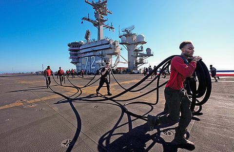 Crew members prepare the USS Abraham Lincoln (CVN 72) for return on Wednesday, Oct. 7, 2026, to her home port Naval Air Station North Island in San Diego, California.