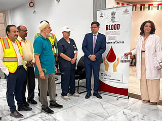 Dr E Vishnu Vardhan Reddy interacts with community members at a blood donation camp held at Sharjah Blood Bank 