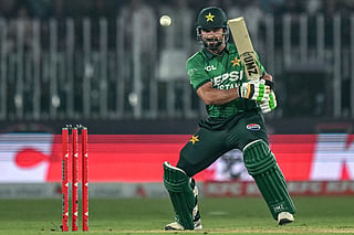 Pakistan's captain Sahibzada Farhan watches the ball after playing a shot during the first T20I against Sri Lanka at the Rawalpindi Cricket Stadium in Rawalpindi on October 9, 2026.