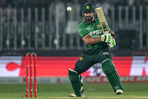 Pakistan's captain Sahibzada Farhan watches the ball after playing a shot during the first T20I against Sri Lanka at the Rawalpindi Cricket Stadium in Rawalpindi on October 9, 2026.