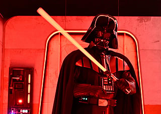 FILE - A Darth Vader costumed character poses at the Hasbro and Amazon Star Wars interactive Imperial March experience at the Empire State Building March 21, 2024, in New York. (Photo by Evan Agostini/Invision/AP, File)