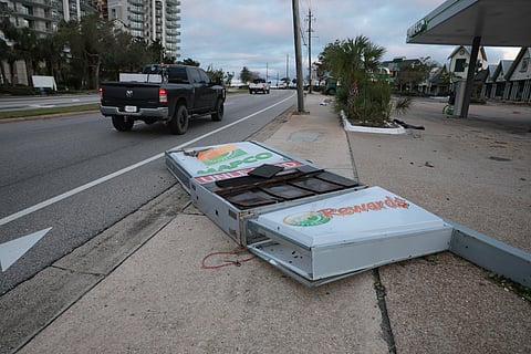 A gas station sign lies on the ground after Hurricane Isaias knocked it over as it passed through the area on October 10, 2026, in Destin, Florida.