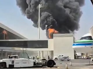 This image from video obtained and verified by AP shows thick black smoke and flames rising from a fire at King Khalid International Airport in Riyadh, Saudi Arabia, on Friday, October 9, 2026. 