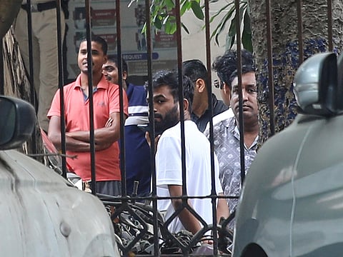 Abhijeet Dipke, centre, founder of the Cockroach Janta Party, stands on the court premises following his release in New Delhi, India, Sunday, Ocober 11, 2026. 