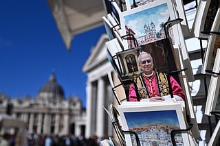 Postcards of Pope Leo XIV are on sale at a souvenirs shop near St Peter's square in the Vatican on October 12, 2026.