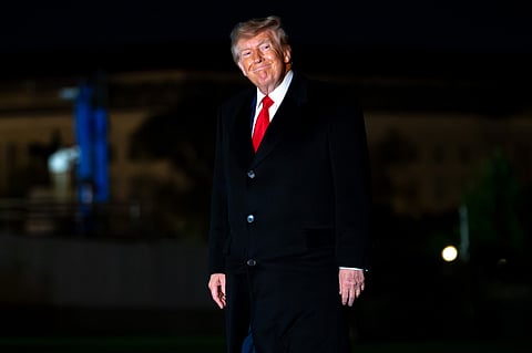 President Donald Trump returns to the White House following a trip to Clarksville, Tenn., on the South Lawn of the White House, Saturday, Oct. 10, 2026, in Washington. (AP Photo/Nathan Howard)