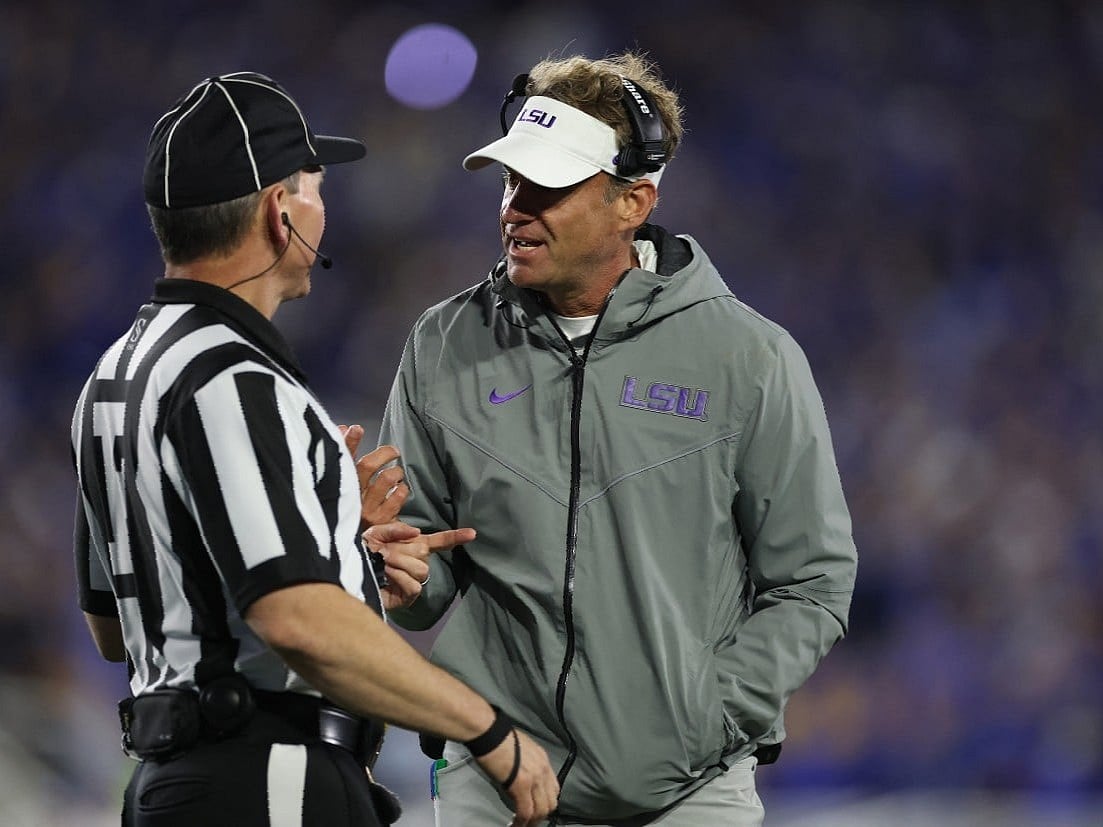 Lane Kiffin the head coach of the LSU Tigers talks with a game official during the game against the Kentucky Wildcats at Kroger Field on October 10, 2026 in Lexington, Kentucky.