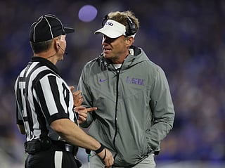 Lane Kiffin the head coach of the LSU Tigers talks with a game official during the game against the Kentucky Wildcats at Kroger Field on October 10, 2026 in Lexington, Kentucky.