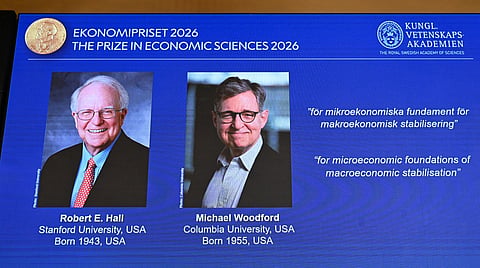 US macroeconomists Robert E Hall and Michael Woodford are seen on a screen as they are announced as the laureates of the 2026 Sveriges Riksbank Prize in Economic Sciences in Memory of Alfred Nobel at the Royal Swedish Academy of Sciences in Stockholm on October 12, 2026.