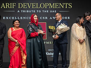 Sheikha Aisha Humaid Al Mulla presents the award to Arif Developments representatives at AES Achievers Summit & Honours 2026

