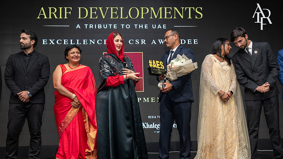 Sheikha Aisha Humaid Al Mulla presents the award to Arif Developments representatives at AES Achievers Summit & Honours 2026

