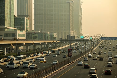 Vehicles drive along the Sheikh Zayed road in Dubai.