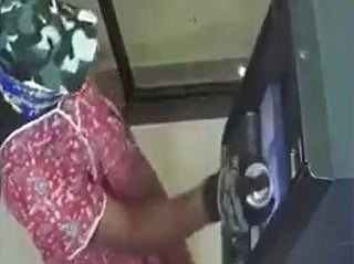 CCTV captures suspects breaking into SBI machine before fleeing with cash.
