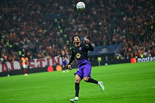 Barcelona's Spanish forward #10 Lamine Yamal eyes the ball during the UEFA Champions League, league phase matchday 2, football match between Galatasaray and Barcelona at the Ali Sami Yen Sports Complex in Istanbul on October 13, 2026.