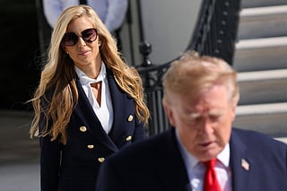 White House Press Secretary Katie Zacharia (L) joins US President Donald Trump as he departs on the South Lawn of the White House on October 13, 2026 in Washington, DC.