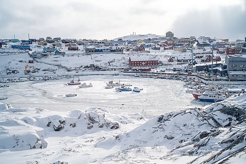 This photograph, taken from the Hotel Arctic, shows the port of Ilulissat trapped in ice, in Greenland, on March 19, 2026.