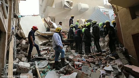 The building collapsed in the Hadayek El Qobba district, prompting a major rescue operation as civil defence teams searched through the rubble for people feared trapped.