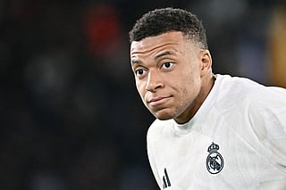 Real Madrid's French forward #10 Kylian Mbappe warms up before the UEFA Champions League - 1st round day 2 football match between AS Roma and Real Madrid at the Olympic Stadium in Rome on October 14, 2026.