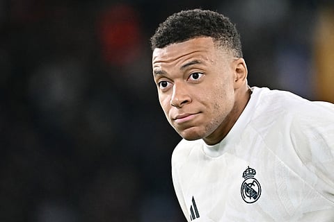 Real Madrid's French forward #10 Kylian Mbappe warms up before the UEFA Champions League - 1st round day 2 football match between AS Roma and Real Madrid at the Olympic Stadium in Rome on October 14, 2026.