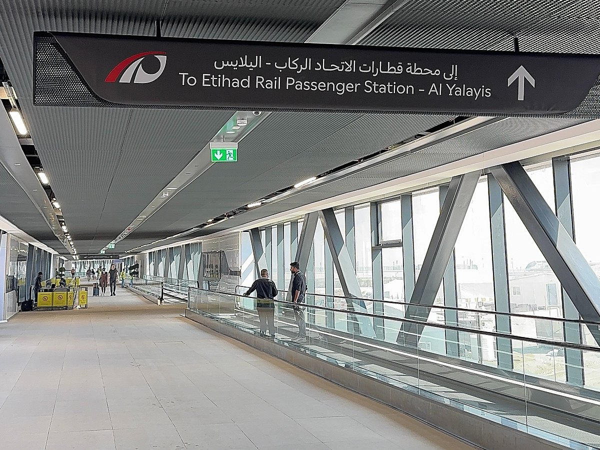Enclosed walkway with travelators offers easy transfer between the two stations.