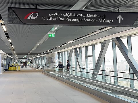Enclosed walkway with travelators offers easy transfer between the two stations.