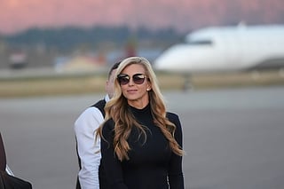 White House press secretary Katie Zacharia arrives with President Donald Trump at Glacier Park International Airport, Wednesday, Oct. 14, 2026, in Kalispell, Mont.