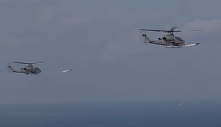 US attach helicopters fire missiles at a "spotter" dhow near Hormuz.