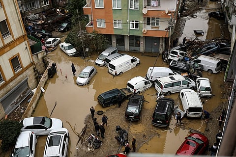 Car owners search for their vehicles swept away by the flood after a heavy rain at Ayazaga district in Istanbul, on October 15,2026.