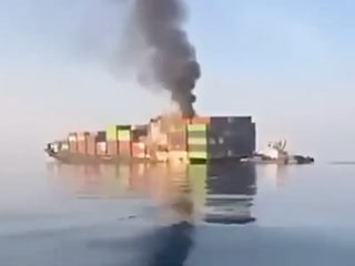 A screenshot from a video footage uploaded by Iranian media shows a cargo ship sinking after it allegedly hit a naval mine while "violating" Iran's rules in an "unauthorise" route in the Strait of Hormuz.