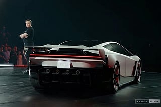 A grab taken on October 16, 2026 from a live feed released by Tesla shows Tech billionaire Elon Musk unveiling on October 15 the next-generation Roadster electric car in McGregor, Texas, United States.