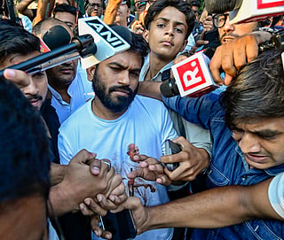 New Delhi: Cockroach Janata Party (CJP) founder Abhijeet Dipke is detained by Delhi Police ahead of the party’s ‘Lehra Do Tiranga’ protest at Connaught Place in New Delhi on Friday, October 16, 2026. (Photo: IANS)