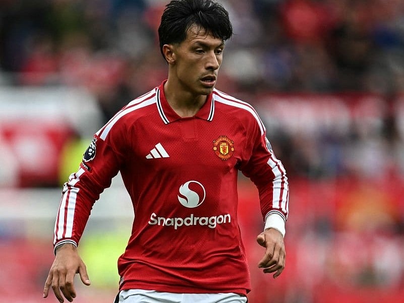 Manchester United's Argentinian defender #06 Lisandro Martinez dribbles the ball during the English Premier League football match between Manchester United and Ipswich Town at Old Trafford in Manchester, north west England, on August 30, 2026.