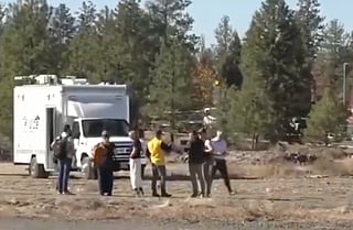 People gather outside Silver Rail Elementary School in Bend, Oregon, after reports of a shooting on Thursday, Oct. 15, 2026.