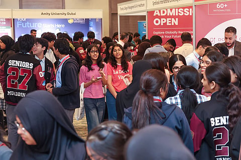 Young learners interacting with university representatives on the first day of Gulf News Edufair Abu Dhabi 
