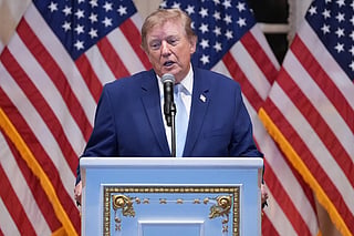 President Donald Trump speaks at a dinner at his Mar-a-Lago club.