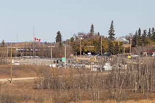 Flags at half mast at Canadian Forces Base Wainwright in Wainwright, Alberta, Canada, on October 18, 2026.