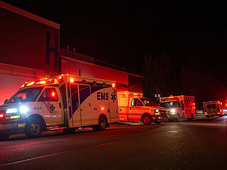 Emergency crews and military personnel gather at the Wainwright Health Centre as injured military members are treated after a fire at Canadian Forces Base Wainwright, outside of Wainwright, Alberta.