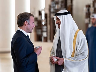 UAE President Sheikh Mohamed bin Zayed Al Nahyan receives France's President Emmanuel Macron at Zayed International Airport in Abu Dhabi.