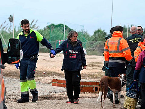 A resident rescued by helicopter is taken to a medical facility in Oliva, eastern Spain, on October 19, 2026 following torrential downpours.