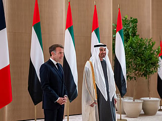 Sheikh Mohamed bin Zayed Al Nahyan receives Emmanuel Macron during an official visit reception at the airport.
